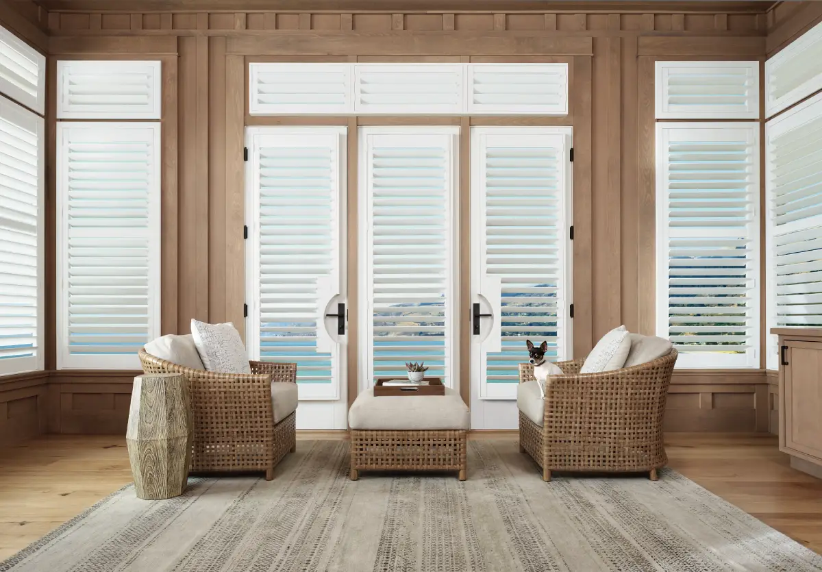 Palm Beach™ Polysatin™ Shutters with a French door cutout in a coastal living room.