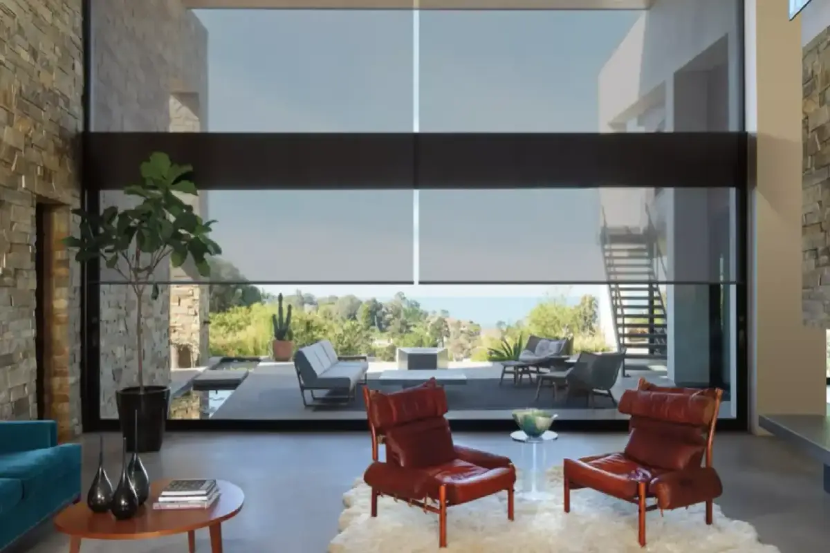 Hunter Douglas Designer Solar Shades cut glare while preserving the view on floor-to-ceiling windows in a modern living room